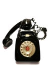 A vintage and antique telephone with white background.